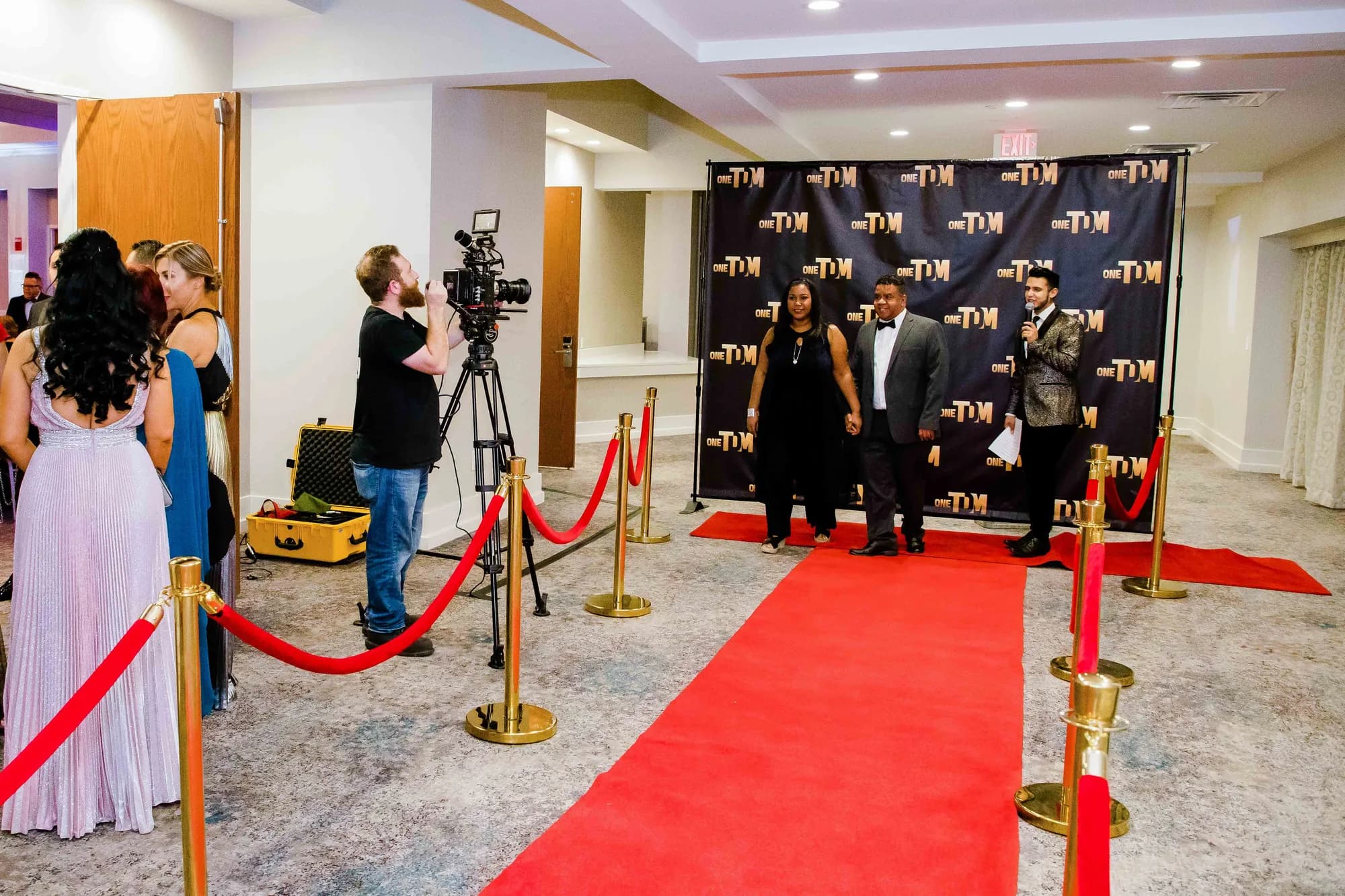Red carpet arrivals area with step and repeat backdrop at an Orlando corporate event