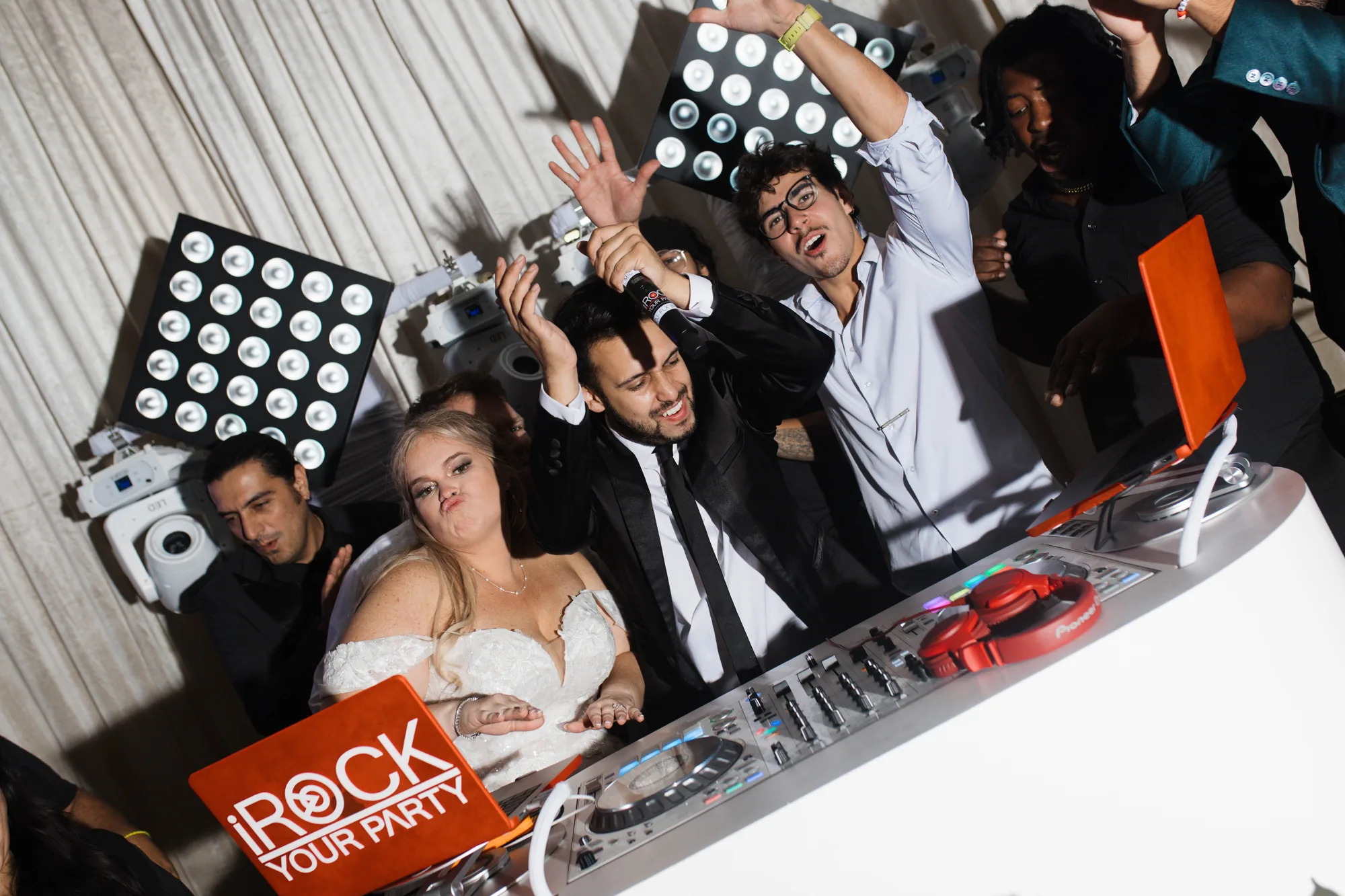 iRock Your Party DJ with the bride, groom and guests packed around the booth