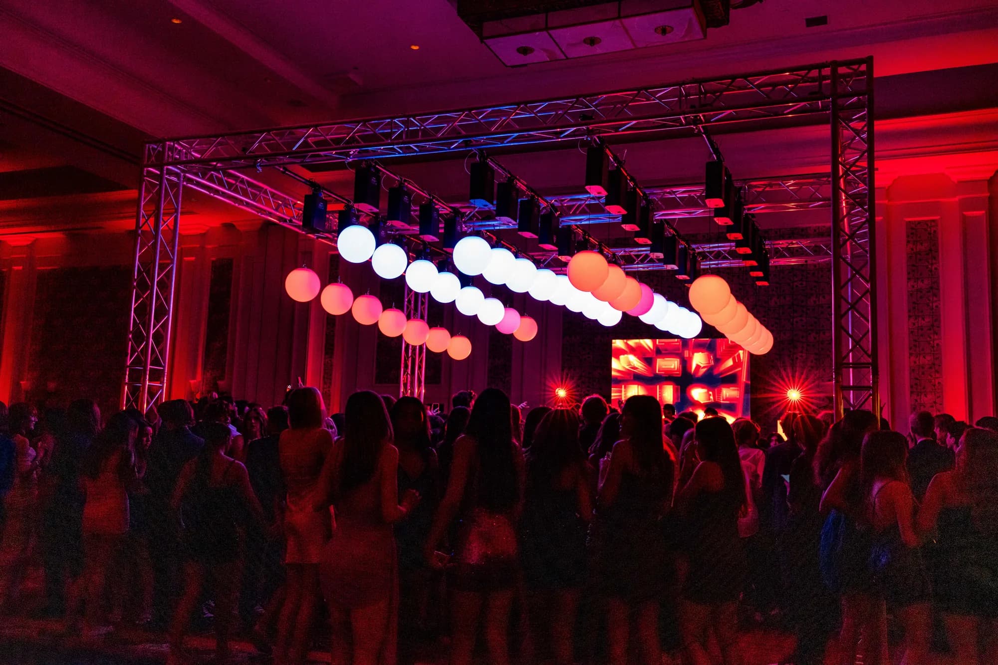 Kinetic spheres lighting a ballroom ceiling at a Central Florida event