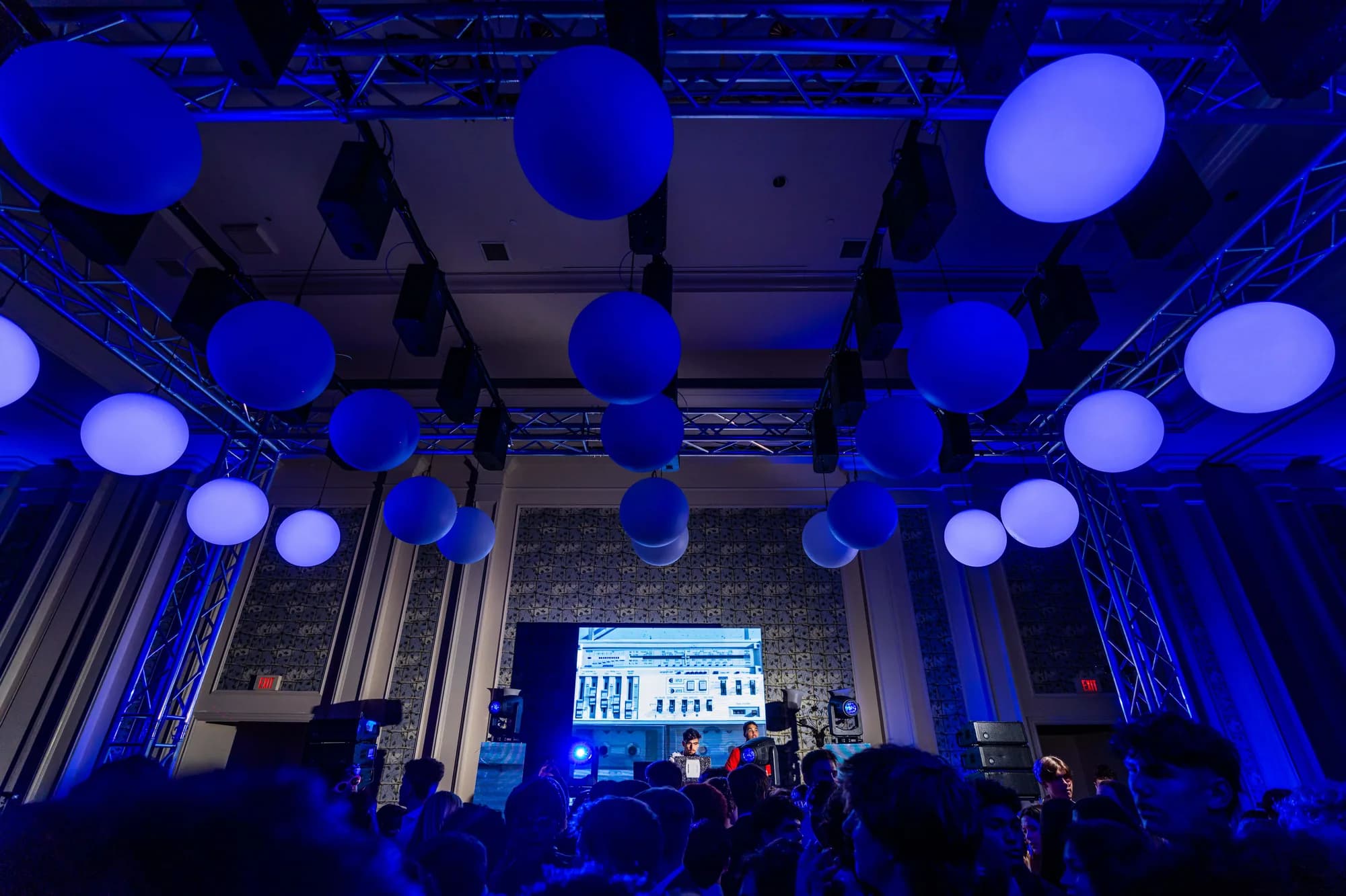 Blue lit kinetic spheres filling the ceiling of an Orlando event space