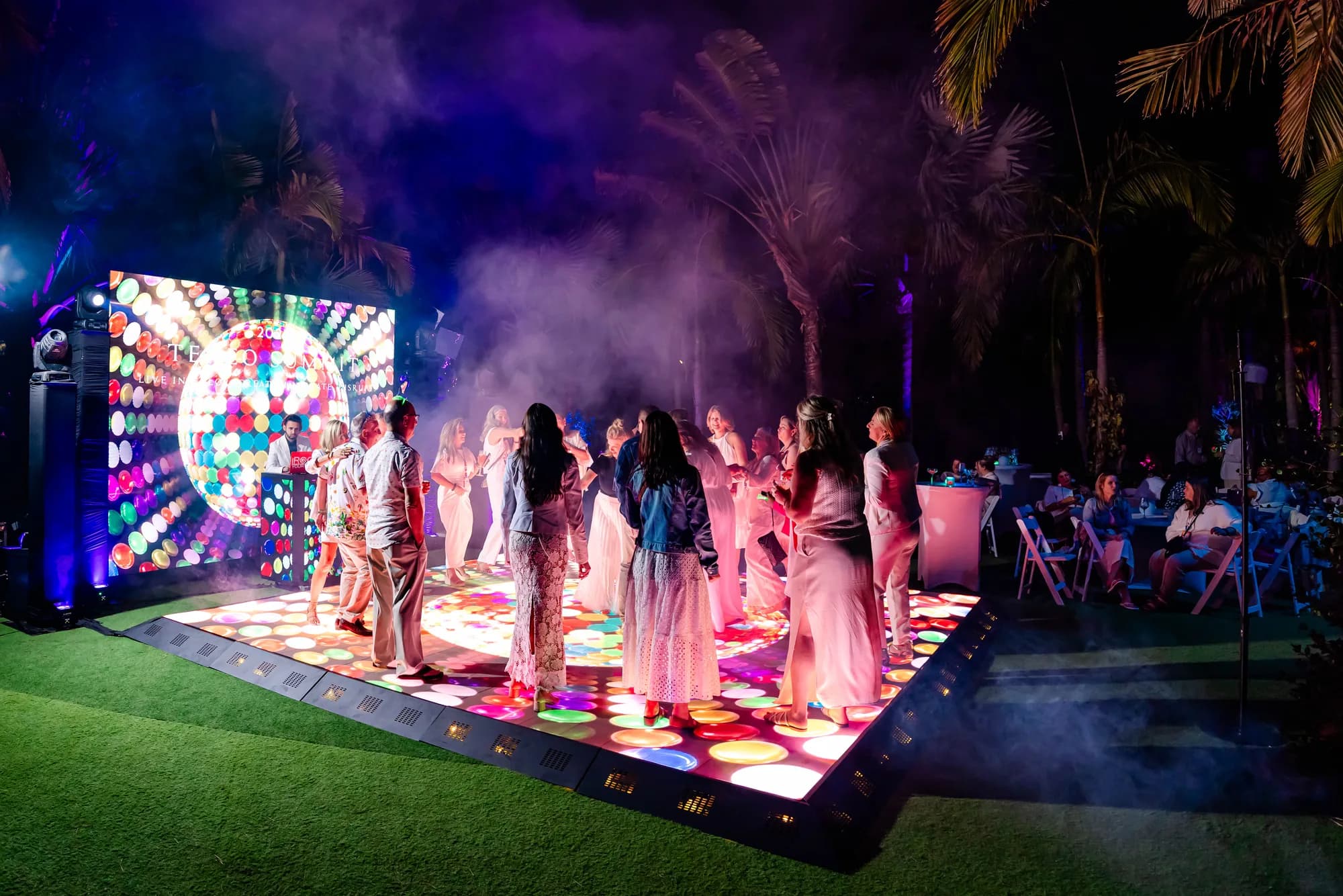 Large LED video wall lighting a stage at an Orlando corporate event produced by iRock Your Party