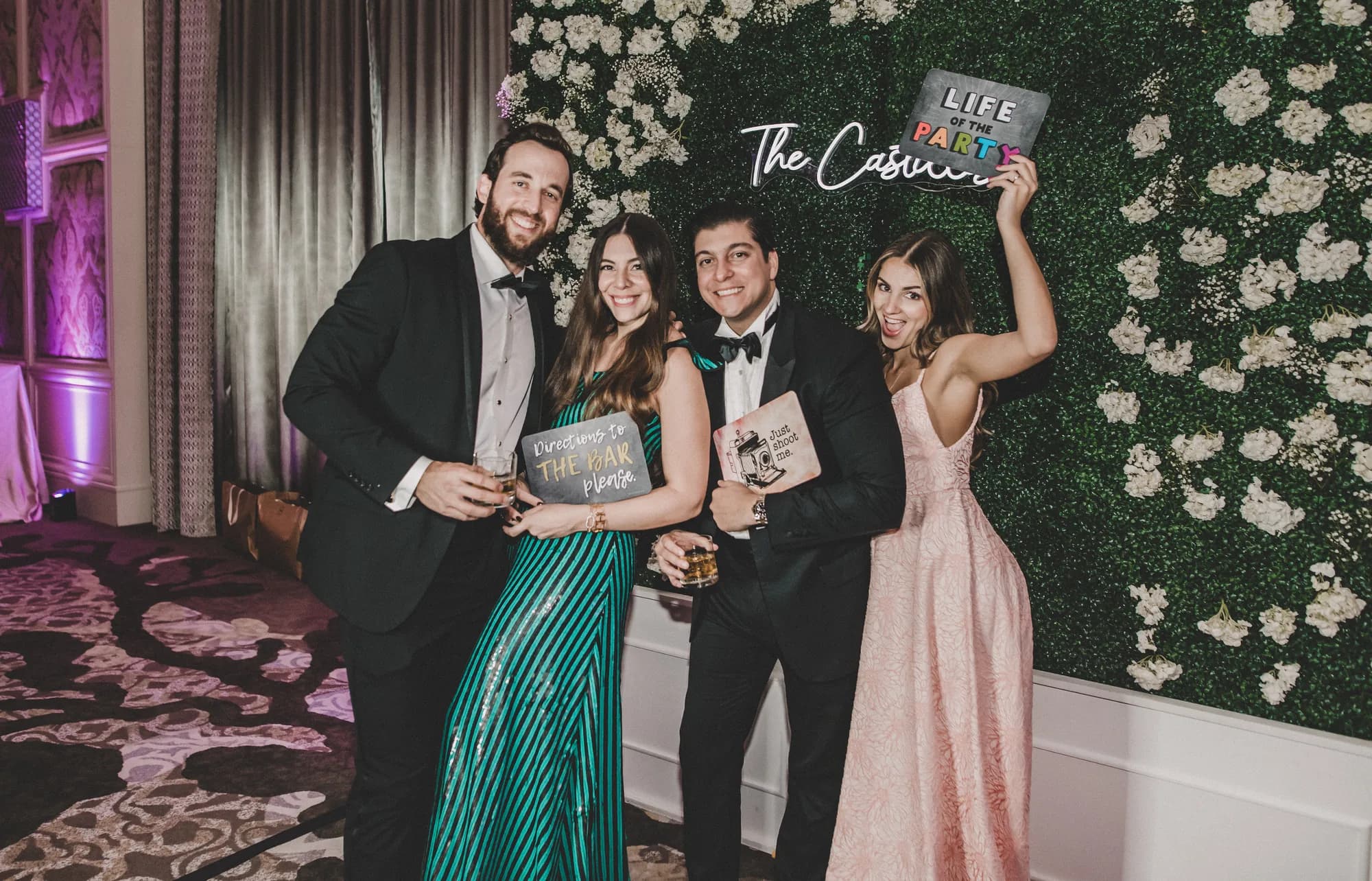 Group of wedding guests with props at an iRock photo booth in Orlando