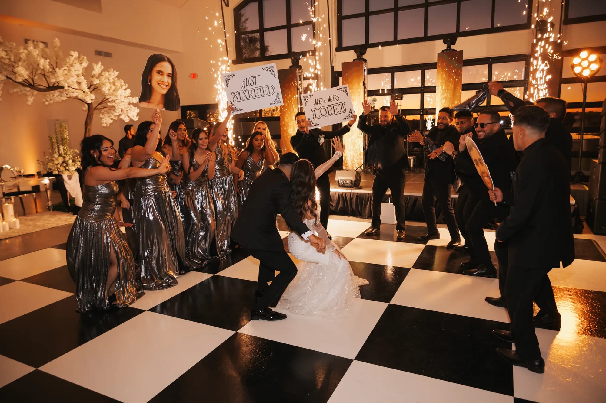Wedding party dancing on a black and white checkered floor at an Orlando reception