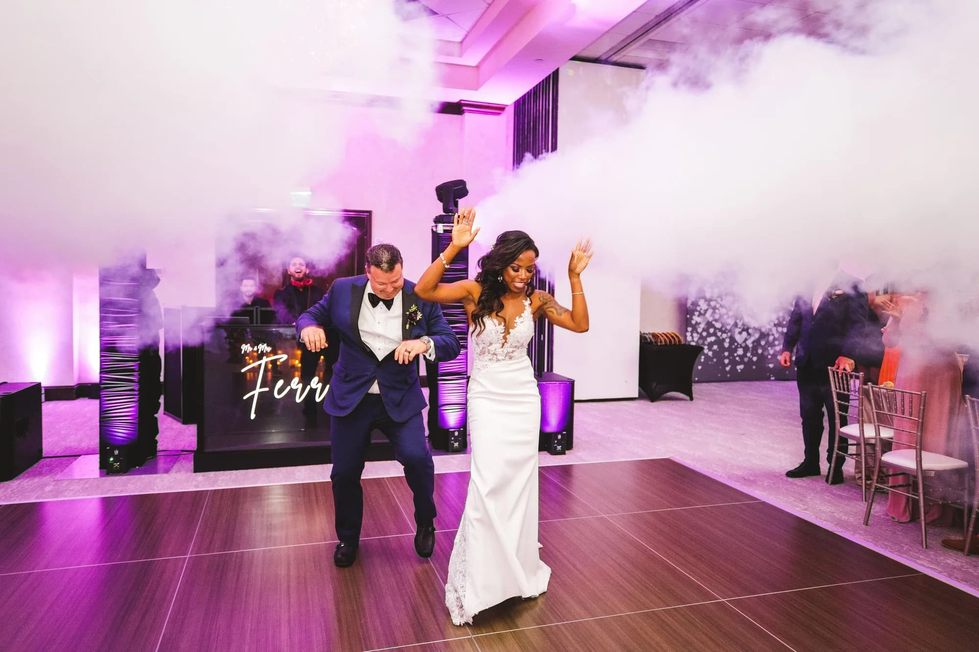 Cold spark fountains framing a couple during their first dance at an Orlando reception