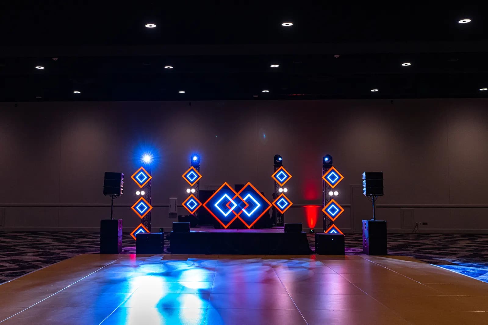 Guests walking through an illuminated projection and LED tunnel at an Orlando event by iRock Your Party