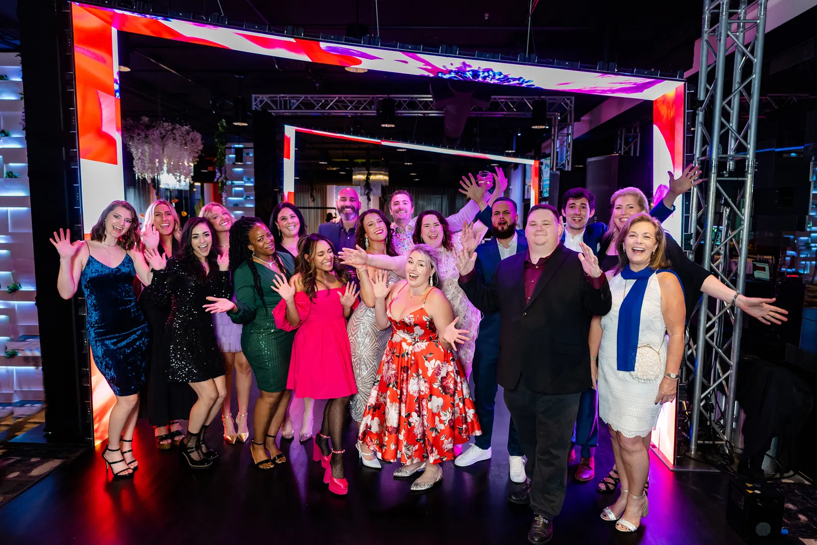 Guests gathered in front of a full LED video wall at an Orlando event